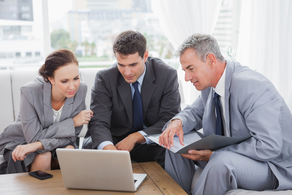 Business team discussing if they need a new eCommerce software for their B2B business.
