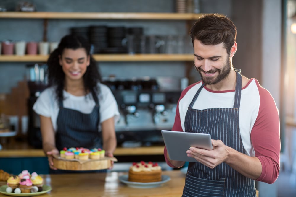 Employee utilizing the new ERP system implemented within their business.