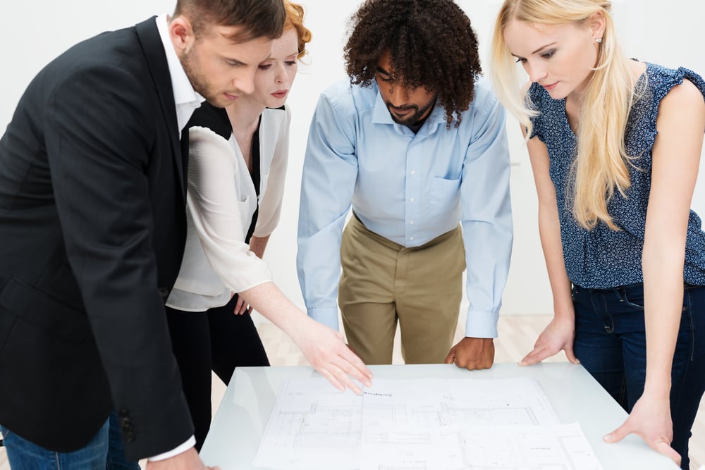 Dedicated business team working on paperwork before their ERP implementation