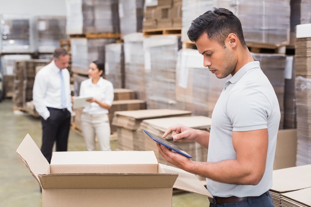 Distribution business employee using ERP software.