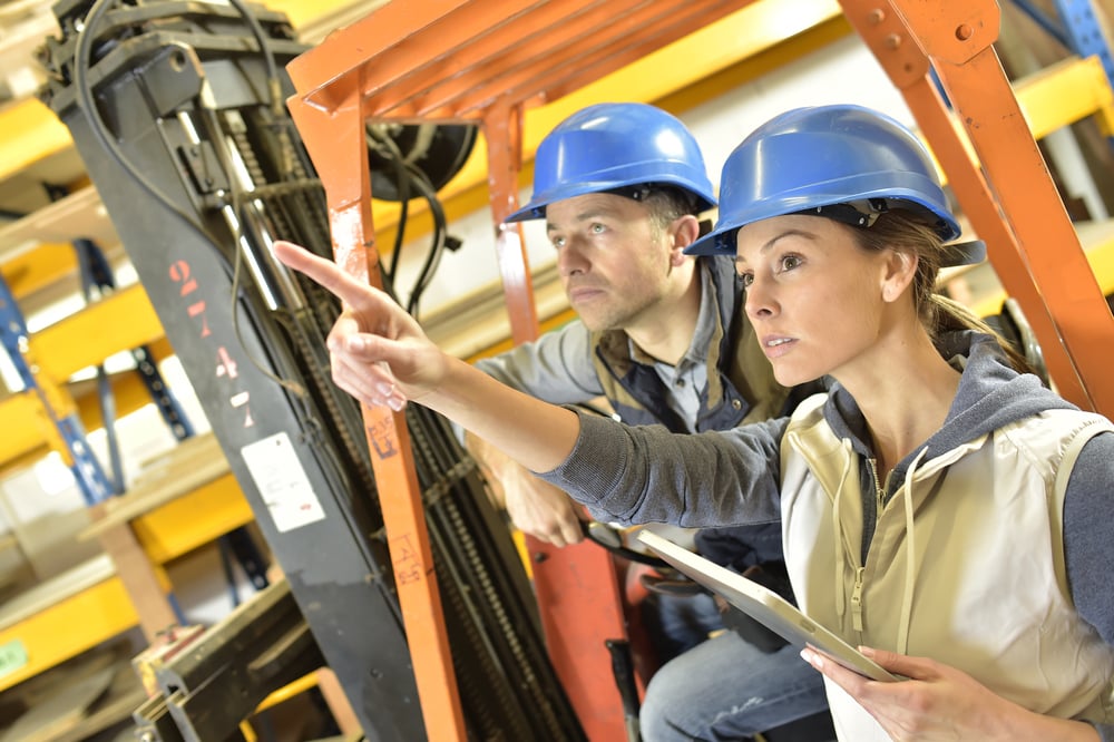 a construction team checks data from ERP platform in warehouse