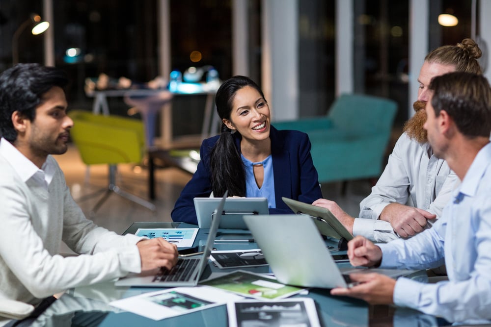 Acumatica partners working at office table